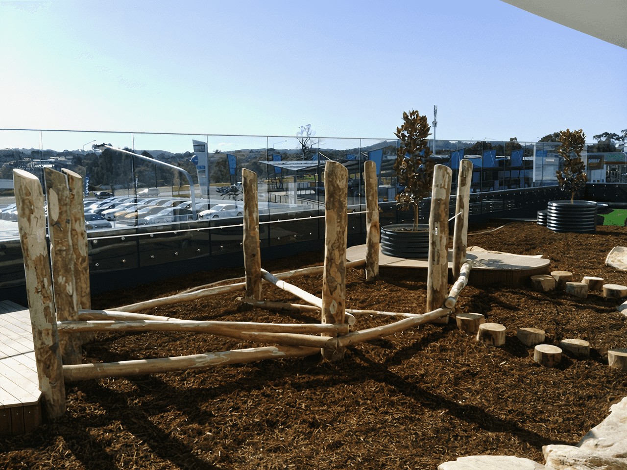 Playground with wooden climbing bridge