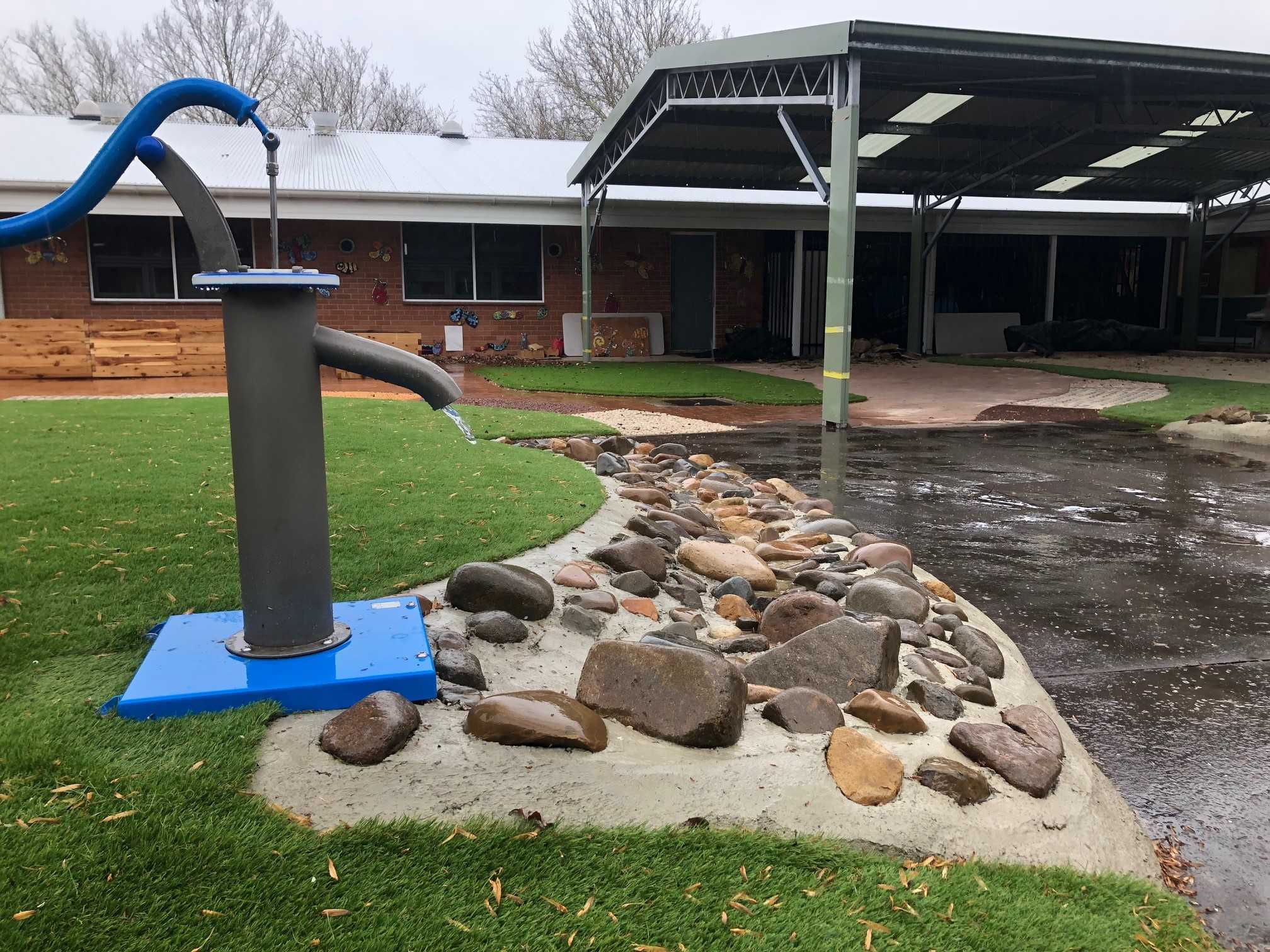 Outdoor water pump and rock feature