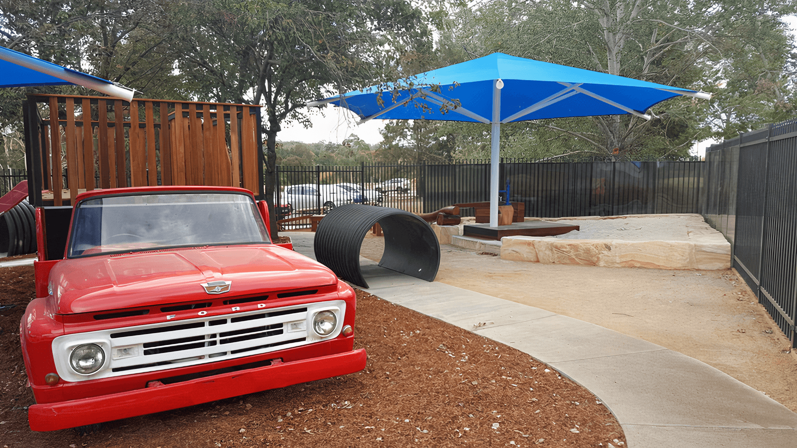 Themed playgrounds with a vintage Ford car and tunnel