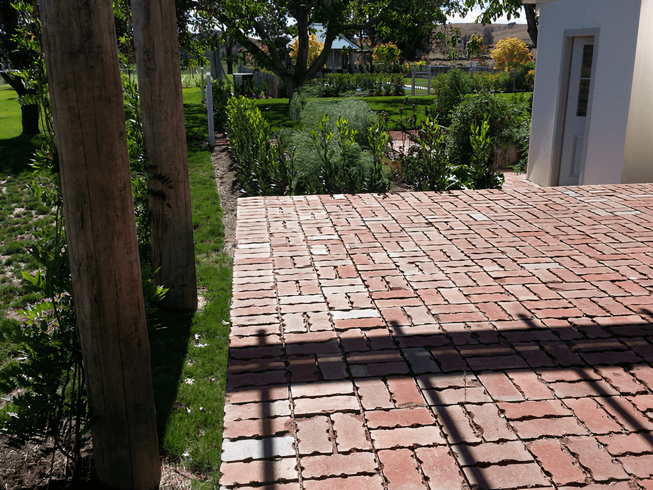 A beautiful brick paved outdoor patio by Dan and Dan Landscaping